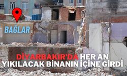 Diyarbakır’da her an yıkılacak binanın içine girdi