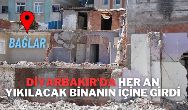 Diyarbakır’da her an yıkılacak binanın içine girdi